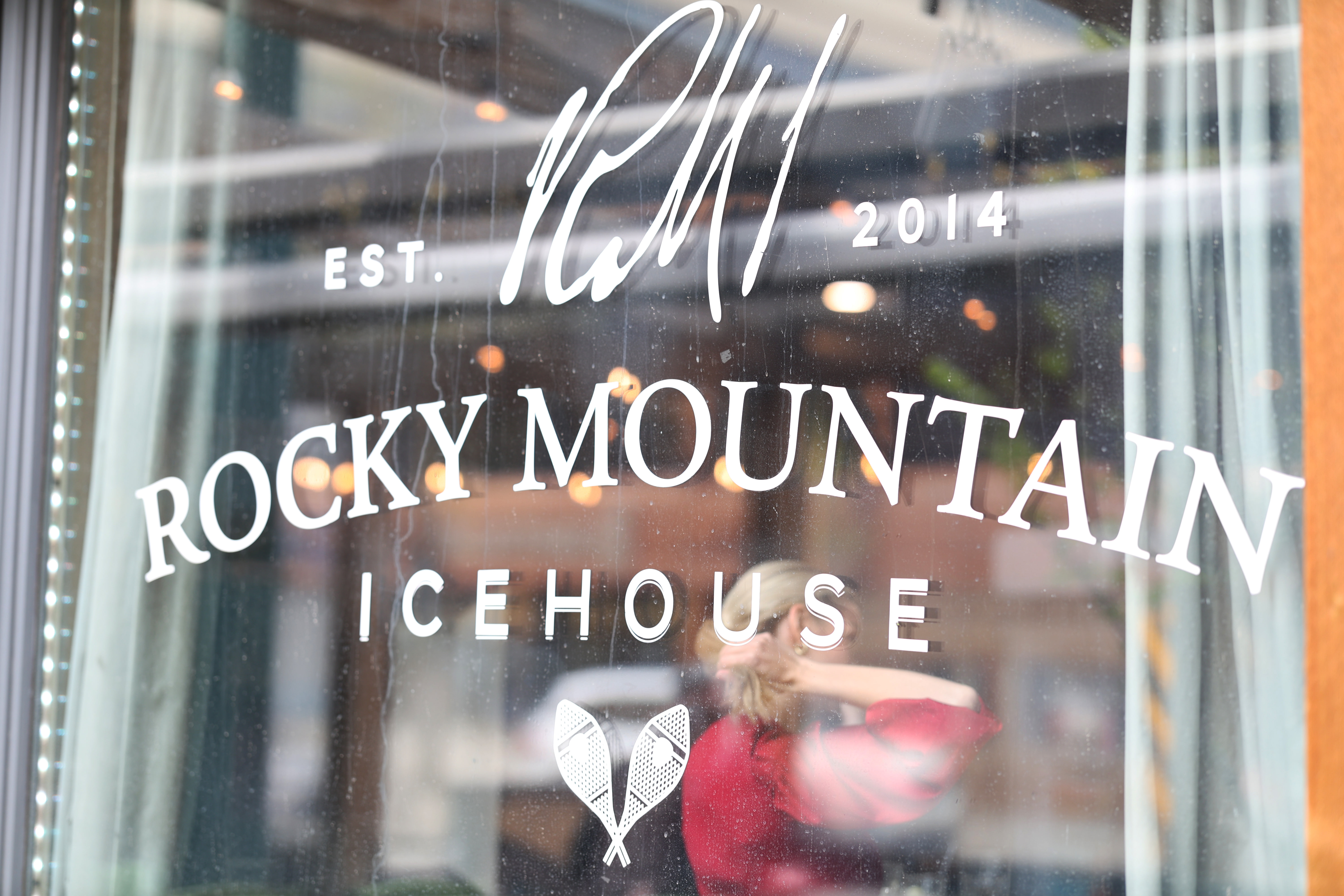 Rocky Mountain Ice House glass window logo establishing the event venue in Edmonton